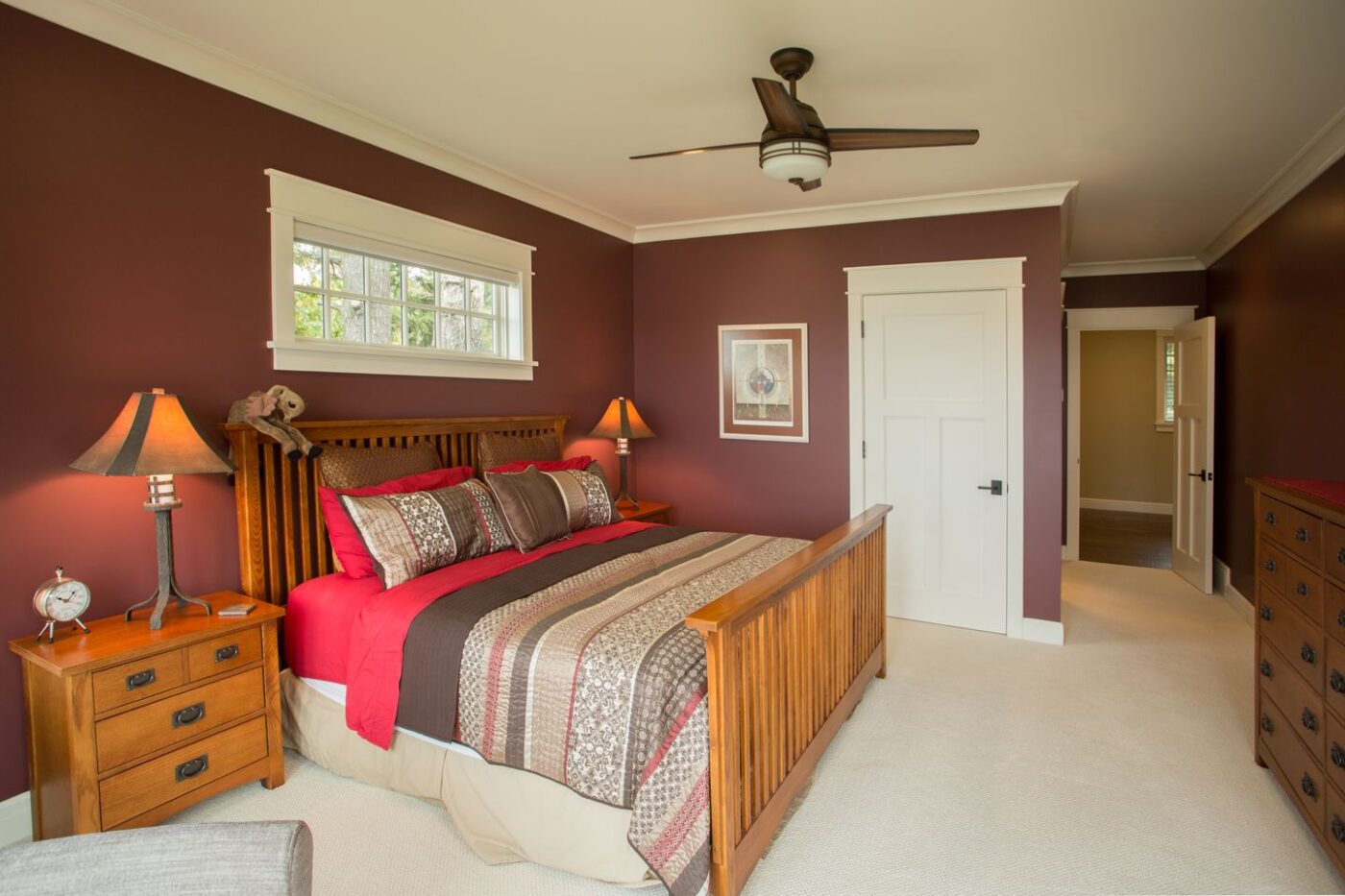 Deep red upstairs bedroom with carpet
